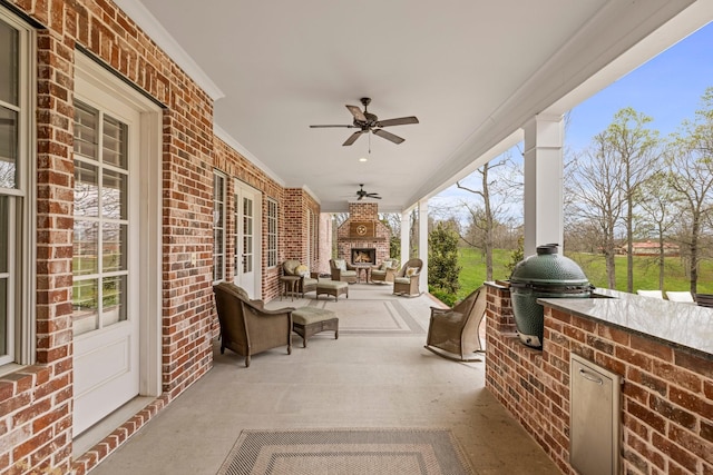 620 Williamson County Line Rd, Fairview, TN 37062 - view of patio with exterior kitchen, ceiling fan, and exterior fireplace