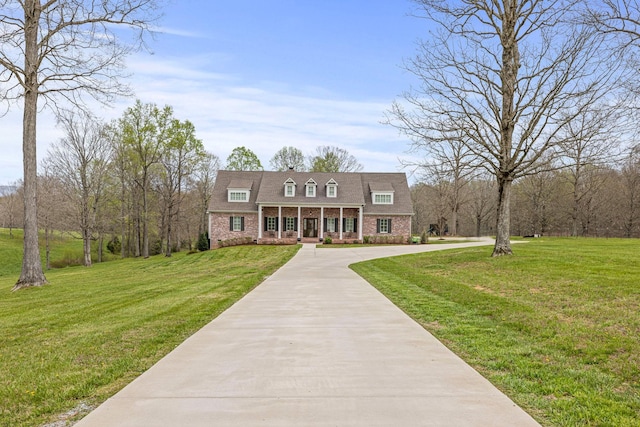 620 Williamson County Line Rd, Fairview, TN 37062 - view of front of property with a porch, concrete driveway, a front lawn, and brick siding