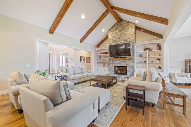 620 Williamson County Line Rd, Fairview, TN 37062 - living room with a chandelier, a fireplace, beamed ceiling, high vaulted ceiling, and light wood finished floors