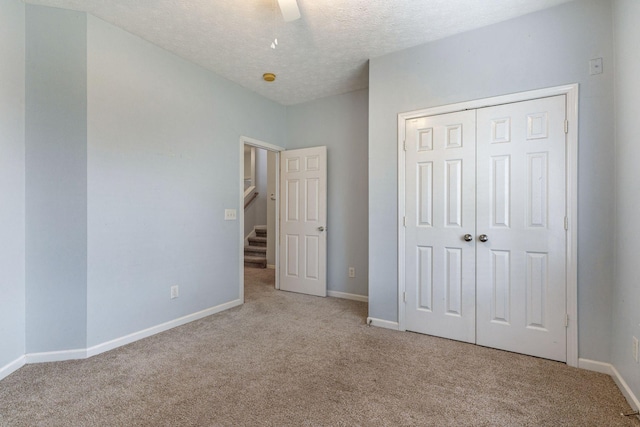 1007 Whitley Pl, Hendersonville, TN 37075 - unfurnished bedroom with a closet, baseboards, a ceiling fan, a textured ceiling, and carpet flooring