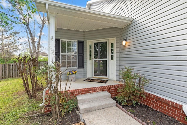 1007 Whitley Pl, Hendersonville, TN 37075 - view of exterior entry featuring a yard, fence, and covered porch