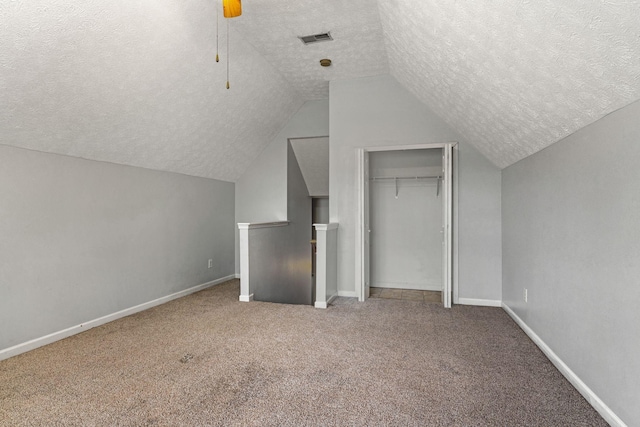 1007 Whitley Pl, Hendersonville, TN 37075 - additional living space with a textured ceiling, vaulted ceiling, visible vents, and carpet floors