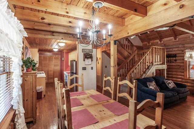 170 N Leath Rd, Portland, TN 37148 - dining room featuring a notable chandelier, wooden ceiling, wood finished floors, and rustic walls