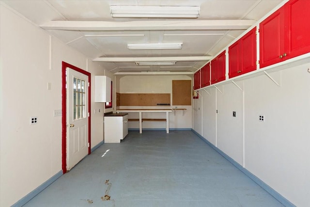 garage featuring baseboards
