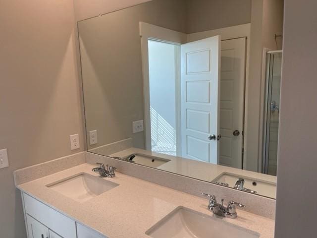 341 Casper Dr, Spring Hill, TN 37174 - bathroom featuring a sink, double vanity, and a stall shower