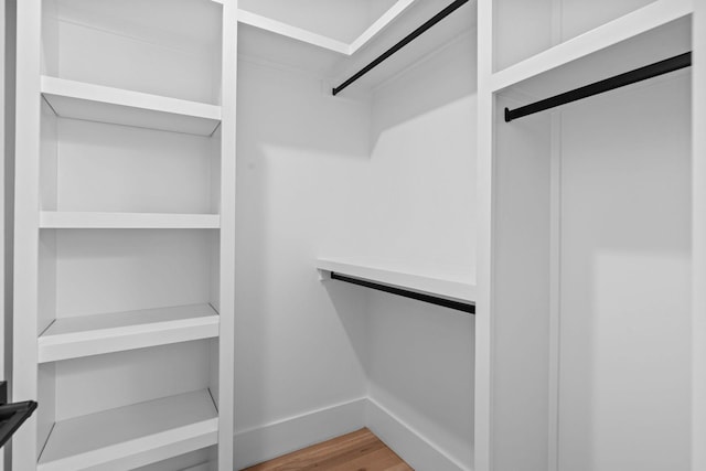 spacious closet featuring wood finished floors