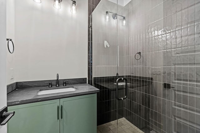 full bathroom with a stall shower and vanity