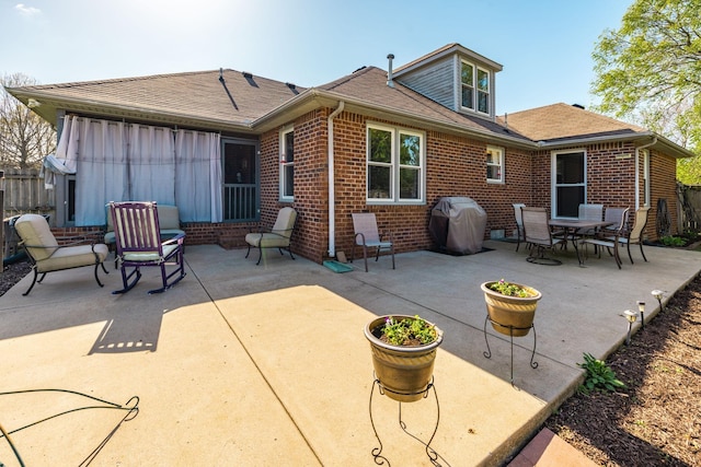 2403 English Hill Dr, Murfreesboro, TN 37130 - back of property featuring a shingled roof, a patio area, fence, and brick siding