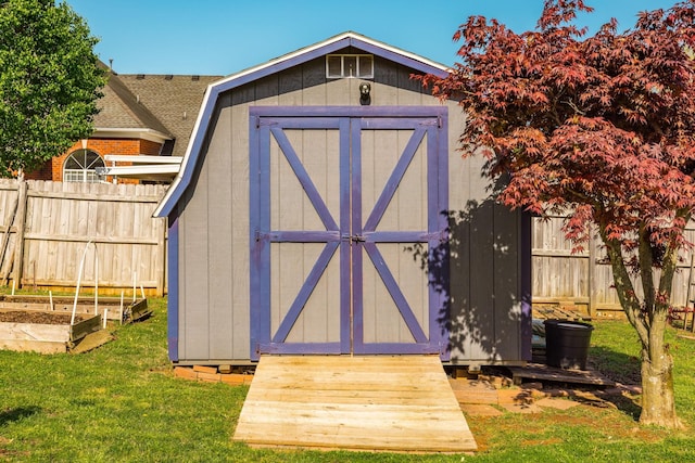 2403 English Hill Dr, Murfreesboro, TN 37130 - view of shed featuring fence and a vegetable garden