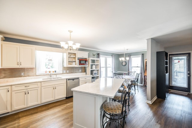 2403 English Hill Dr, Murfreesboro, TN 37130 - kitchen with a breakfast bar, an inviting chandelier, built in microwave, stainless steel dishwasher, and a sink