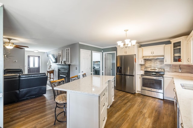 2403 English Hill Dr, Murfreesboro, TN 37130 - kitchen featuring stainless steel appliances, open floor plan, dark wood-style flooring, and ceiling fan with notable chandelier