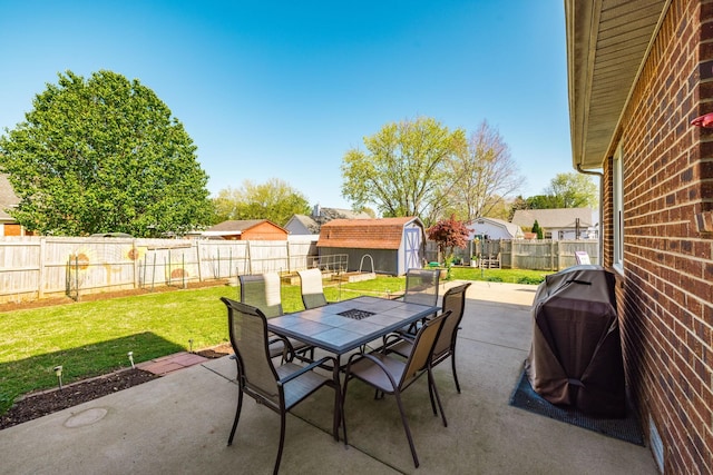 2403 English Hill Dr, Murfreesboro, TN 37130 - view of patio / terrace featuring an outbuilding, a shed, a fenced backyard, grilling area, and outdoor dining area