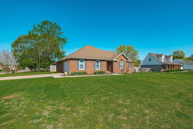 2403 English Hill Dr, Murfreesboro, TN 37130 - ranch-style house featuring an attached garage, driveway, a front lawn, and brick siding