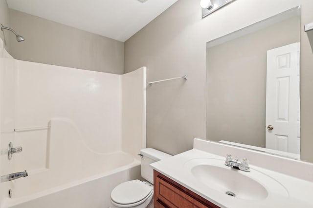 bathroom with washtub / shower combination, toilet, and vanity