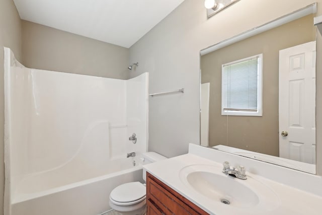 bathroom with toilet, shower / bath combination, and vanity