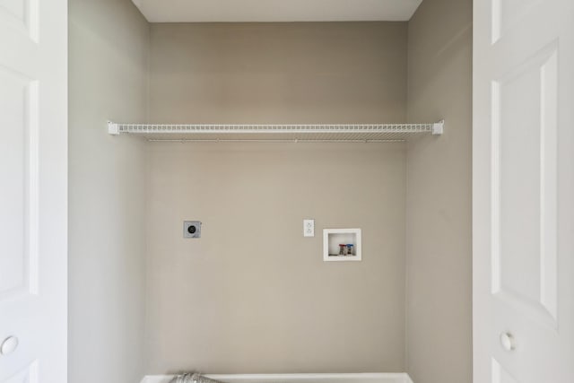 laundry room featuring electric dryer hookup, hookup for a washing machine, and laundry area