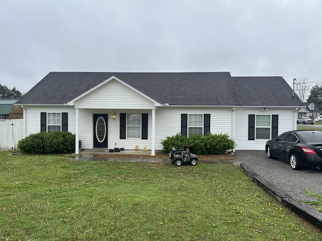 single story home with a front yard