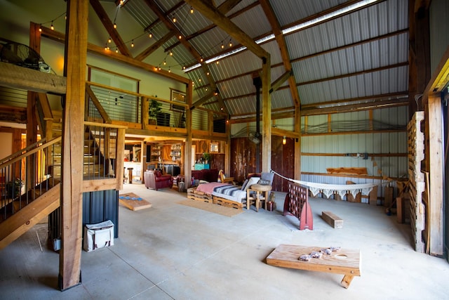 0 Burnt Hill Rd, Unionville, TN 37180 - miscellaneous room with high vaulted ceiling, metal wall, concrete flooring, and stairs