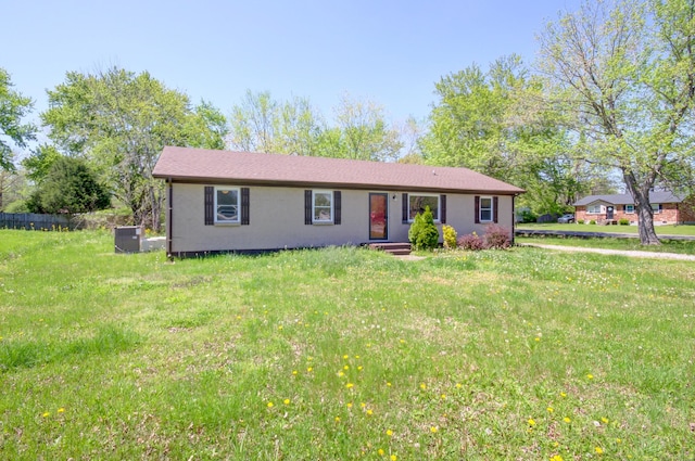 ranch-style home with a front yard