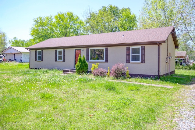 ranch-style home with a detached garage