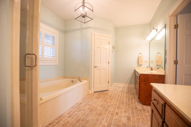 2132 Neelys Bend Rd, Madison, TN 37115 - full bath with vanity, brick patterned floors, a garden tub, a stall shower, and baseboards