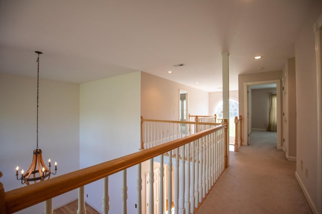 2132 Neelys Bend Rd, Madison, TN 37115 - hallway featuring a chandelier, light carpet, recessed lighting, baseboards, and an upstairs landing