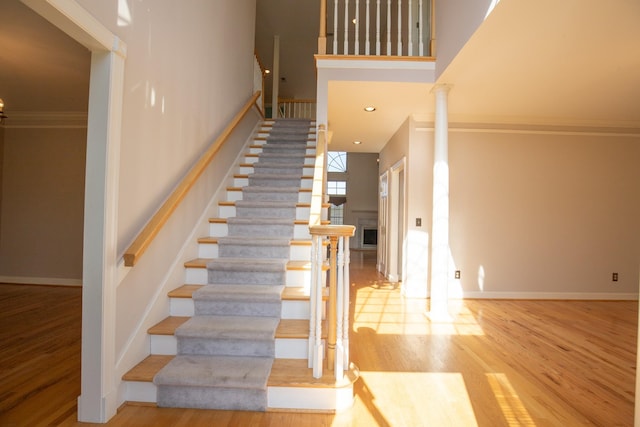 2132 Neelys Bend Rd, Madison, TN 37115 - stairway with a high ceiling, wood finished floors, ornamental molding, baseboards, and decorative columns