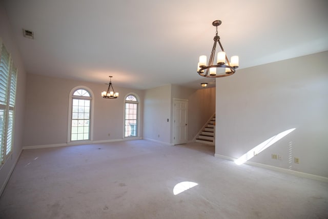 2132 Neelys Bend Rd, Madison, TN 37115 - spare room featuring a chandelier, baseboards, and light carpet