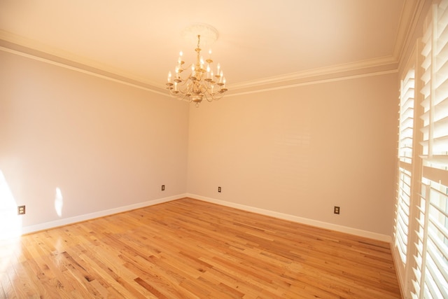 2132 Neelys Bend Rd, Madison, TN 37115 - spare room featuring crown molding, a chandelier, light wood-style floors, and baseboards