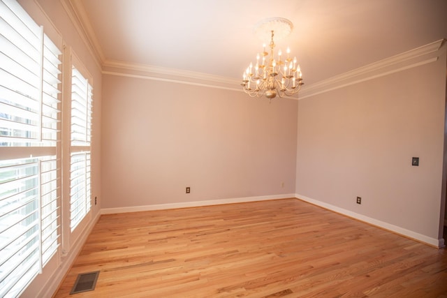 2132 Neelys Bend Rd, Madison, TN 37115 - unfurnished room with a chandelier, ornamental molding, light wood-type flooring, and baseboards
