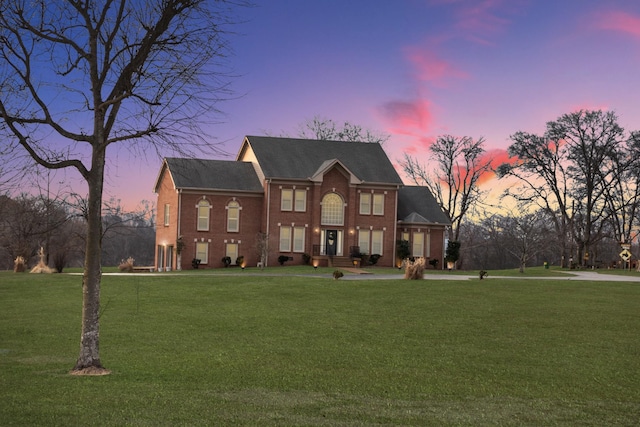 2132 Neelys Bend Rd, Madison, TN 37115 - view of front of house featuring brick siding, a lawn, and a shingled roof