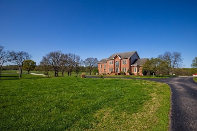 2132 Neelys Bend Rd, Madison, TN 37115 - view of front of house with a front lawn, brick siding, and driveway