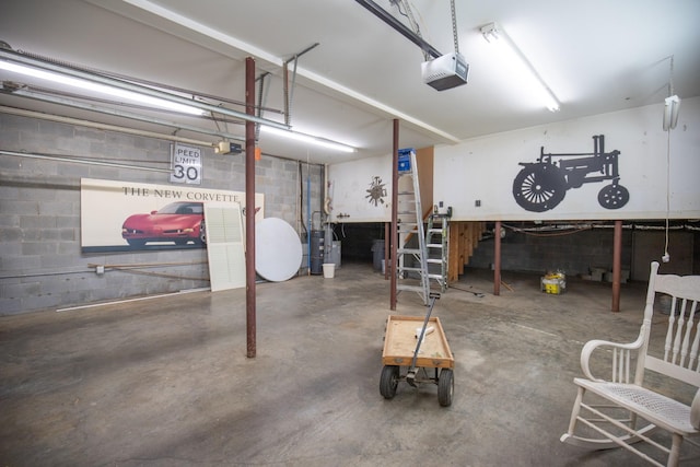 2132 Neelys Bend Rd, Madison, TN 37115 - garage featuring a garage door opener and concrete block wall