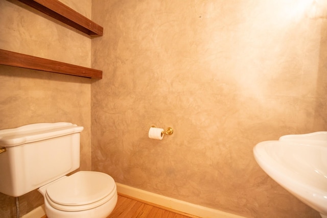 2132 Neelys Bend Rd, Madison, TN 37115 - bathroom with wood finished floors, a sink, baseboards, and toilet