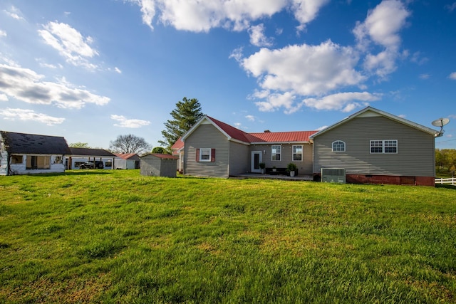 501 Burnt Hill Rd, Unionville, TN 37180 - rear view of property with a yard, cooling unit, metal roof, and crawl space
