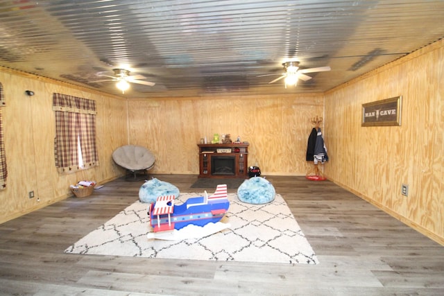 320 Benson Rd, Reagan, TN 38368 - interior space with wood walls, a ceiling fan, and wood finished floors