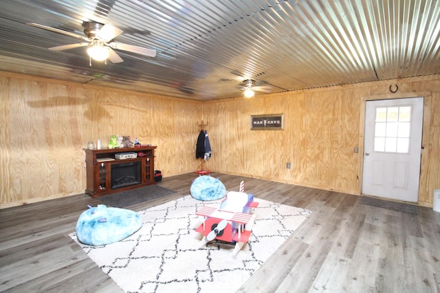 320 Benson Rd, Reagan, TN 38368 - living room with wood ceiling, wood finished floors, wooden walls, and a ceiling fan