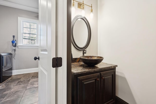 61 Harbor Cove Dr, Old Hickory, TN 37138 - bathroom with washer / clothes dryer, crown molding, vanity, and baseboards