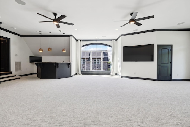 61 Harbor Cove Dr, Old Hickory, TN 37138 - unfurnished living room featuring ceiling fan, ornamental molding, visible vents, and indoor bar