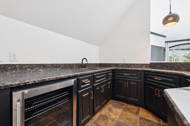61 Harbor Cove Dr, Old Hickory, TN 37138 - kitchen featuring vaulted ceiling, dark countertops, dark cabinetry, wine cooler, and a sink