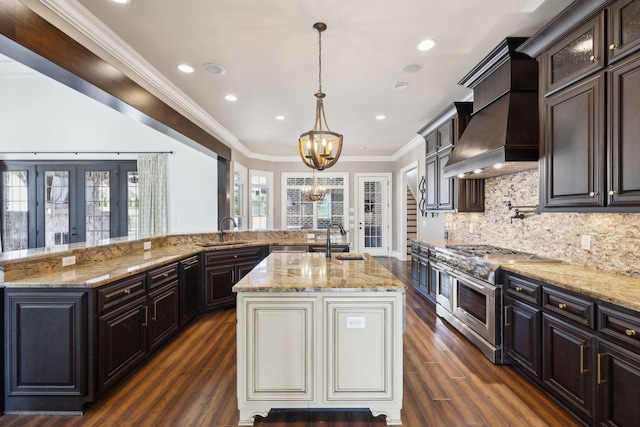 61 Harbor Cove Dr, Old Hickory, TN 37138 - kitchen featuring an inviting chandelier, an island with sink, double oven range, a sink, and custom range hood