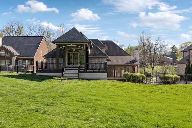 61 Harbor Cove Dr, Old Hickory, TN 37138 - rear view of property featuring a shingled roof, fence private yard, and a lawn