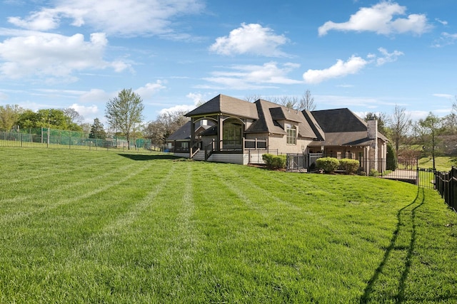 61 Harbor Cove Dr, Old Hickory, TN 37138 - back of house featuring a chimney, fence, and a lawn