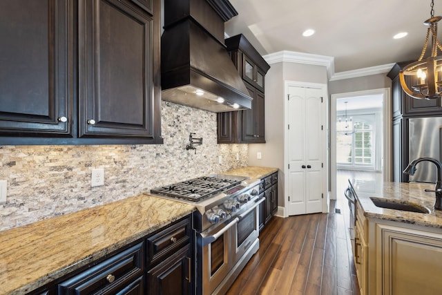 61 Harbor Cove Dr, Old Hickory, TN 37138 - kitchen with dark brown cabinetry, light stone counters, a sink, stainless steel appliances, and custom range hood