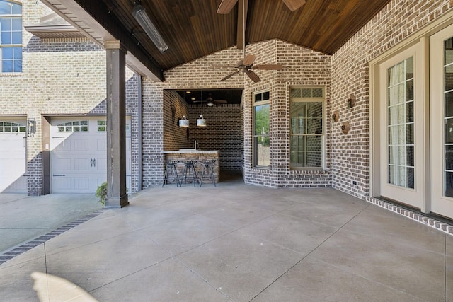 61 Harbor Cove Dr, Old Hickory, TN 37138 - view of patio / terrace with outdoor dry bar, ceiling fan, a garage, and concrete driveway