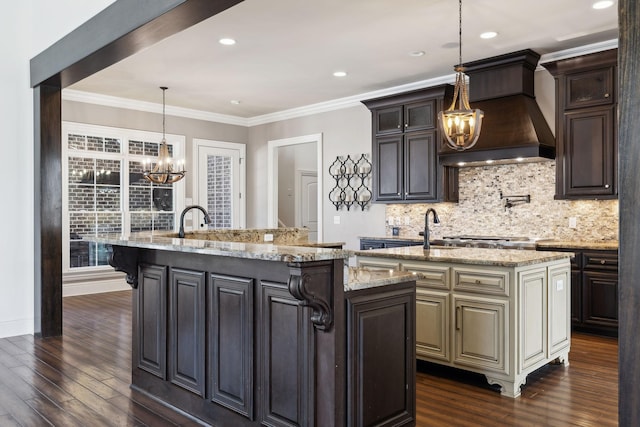 61 Harbor Cove Dr, Old Hickory, TN 37138 - kitchen with custom range hood, an island with sink, a notable chandelier, and dark wood-style floors
