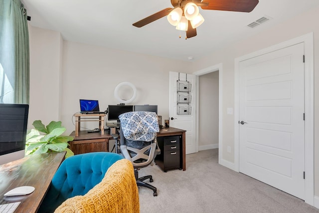 office area with light carpet, ceiling fan, baseboards, and visible vents