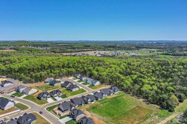 aerial view with a forest view and a residential view