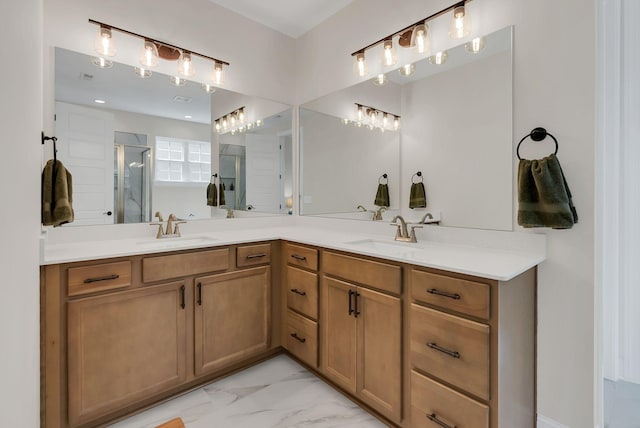 bathroom featuring double vanity, marble finish floor, a sink, and a stall shower