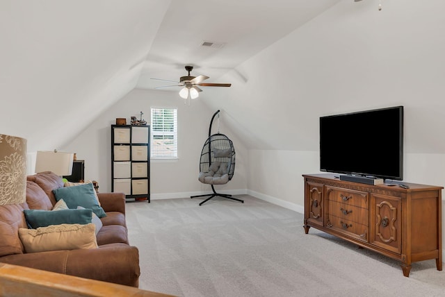 living area featuring ceiling fan, light colored carpet, visible vents, lofted ceiling, and baseboards